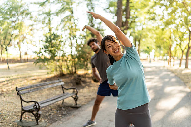 istock Young couple stretching together in the park before running 2224957155