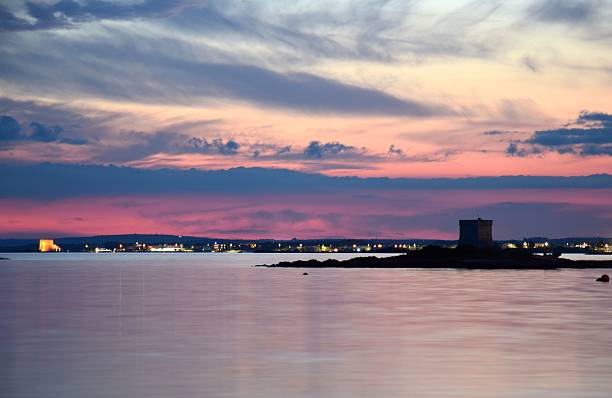 Dramatic sky at sunset by the sea in Salento, Italy