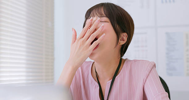 istock asian woman fatigued at work 2224960648