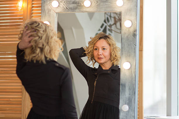 istock A Confident Woman Reflecting in the Mirror 2224960763