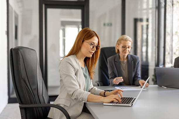 istock Focused professional woman working at the office laptop 2224966074