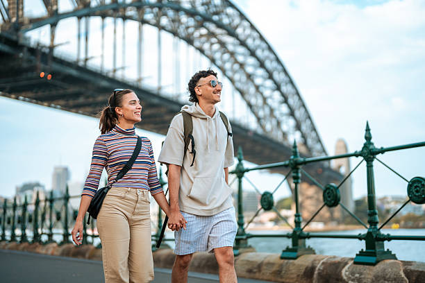istock Young Hispanic Couple Exploring Sydney Harbor Bridge Outdoors 2224967331