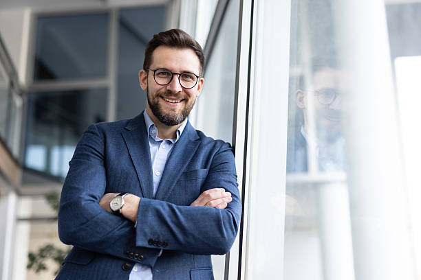 istock Confident businessman alongside a large glass window 2224971831
