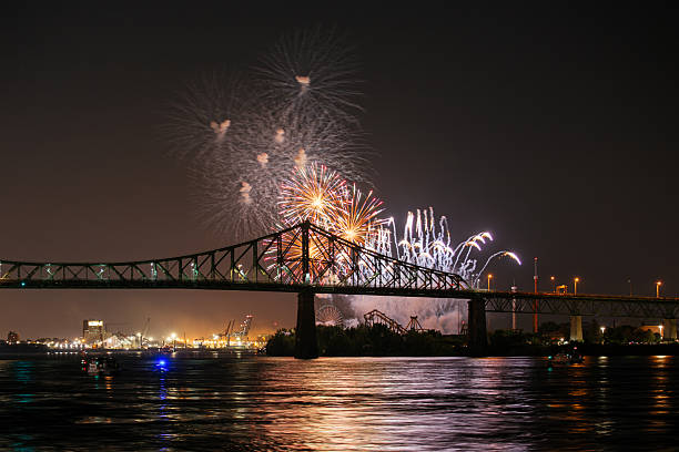 istock Drone flight through holiday fireworks above water with reflection on the black sky background! 2224973122