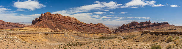 istock Spotted Wolf Canyon panorama with blue sky and scattered clouds 2224989917