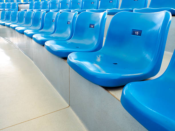 istock Empty blue plastic seats or stadium chairs with numbers in aquarium show or stadium. Rows of seats pattern, on the steps with nobody. 2224992598