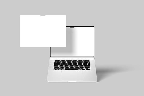 istock Silver laptop with black keyboard and blank white screen, shown from an angled top view with a floating blank screen. Perfect for tech and design mockups. 2224993890