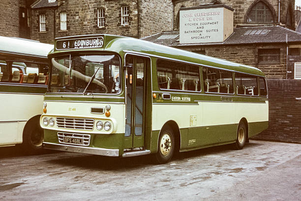 Edinburgh, Scotland - July 14, 2022:  A tourbus is passing by the Tolbooth Kirk (church) on Castle Hill in Edinburgh Old Town.