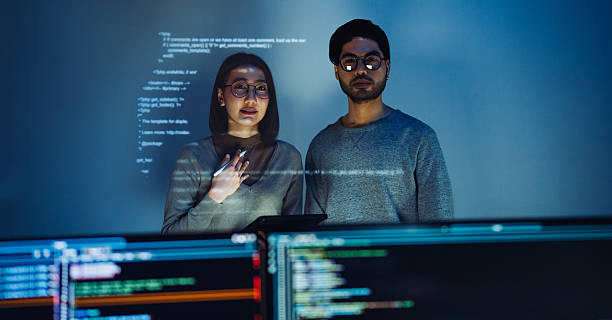 istock asian woman programmer standing in front of a screen with code projected  presentation the integration of technology and human expertise in software development 2224999369