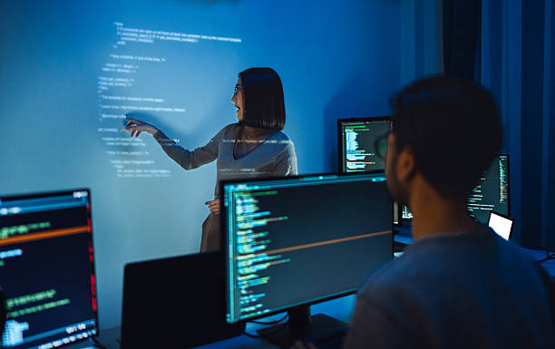 istock asian woman programmer standing in front of a screen with code projected  presentation the integration of technology and human expertise in software development 2224999372