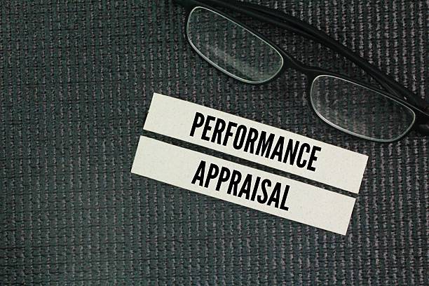 istock Glasses and paper with the words performance appraisal. a structured process used by organizations to assess an employee's job performance 2224999889