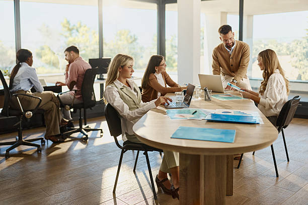 istock Business colleagues working in casual office. 2225000011