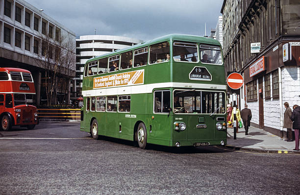 Scotland, UK - 1973: Vintage image of bus in central Glasgow.  Eastern Scottish Daimler CRG6/ECW DD 418 (registration number USF 418J) followed by a Central SMT bus.