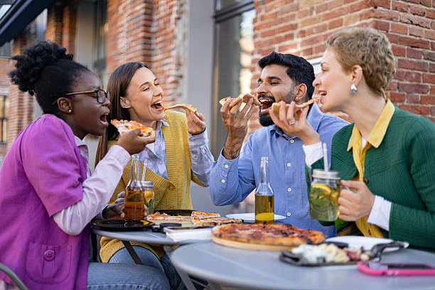 istock Friends Sharing Pizza Outdoors 2225007910