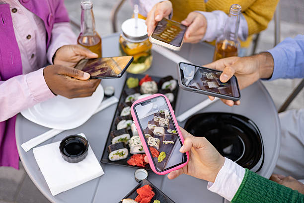 istock Friends Photographing Sushi Together 2225007914