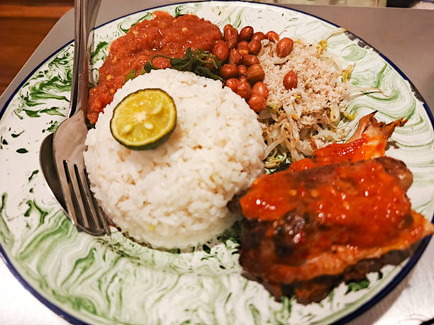istock Delicious Indonesian Nasi Campur Dish with Rice, Chicken, and Vegetable Accompaniments 2225007982