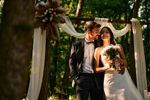 istock Happy Couple Enjoying Their Intimate Forest Wedding Ceremony 2225009171