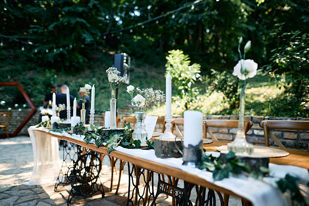 istock Wedding table setting featuring Singer sewing machine base in outdoor garden 2225009597