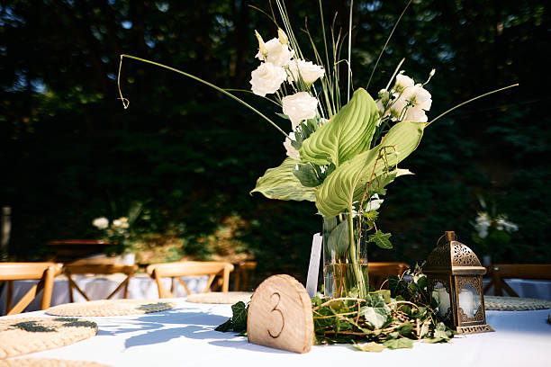 Elegant floral centerpiece illuminating wedding table setting number 3