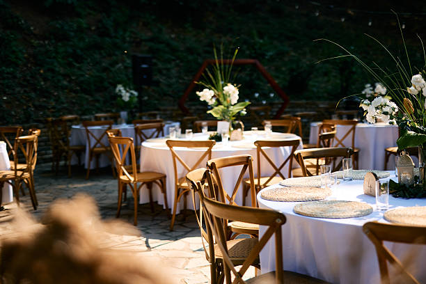 istock Wedding reception tables and chairs awaiting guests in a beautiful outdoor setting 2225009758