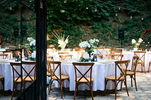 istock Wedding reception tables and chairs awaiting guests in a beautiful outdoor setting 2225009770