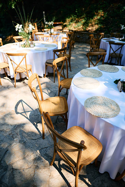 istock Wedding reception tables and chairs waiting for guests in a beautiful outdoor setting 2225009824
