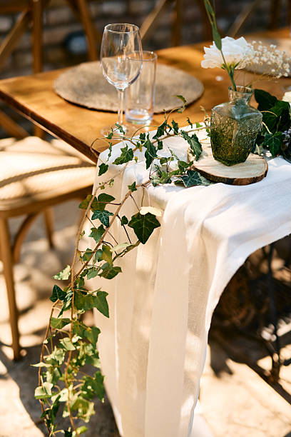 istock Wedding table decorated with ivy and flowers in a rustic style 2225010012