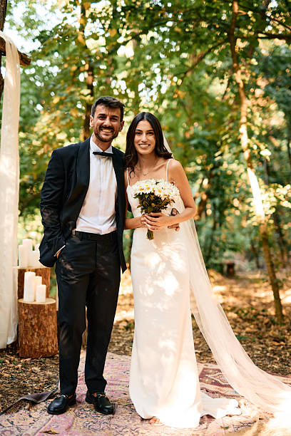 istock Happy newlyweds posing in the forest after their wedding ceremony 2225010517