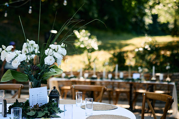 istock Elegant white flowers decorating wedding table in a beautiful garden 2225010703