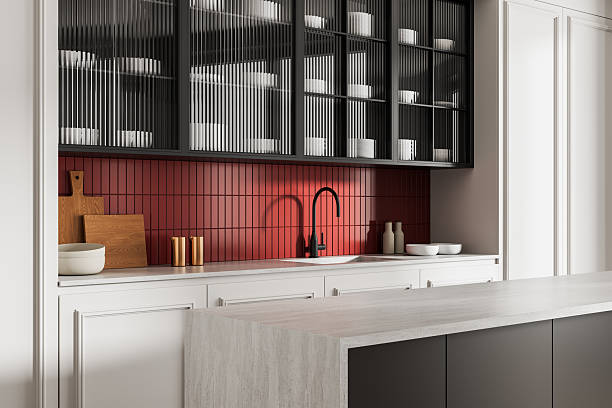 istock Modern kitchen interior with red tile backsplash, minimalist decor, and textured surfaces in a contemporary concept style. 3D Rendering. 3D Rendering 2225012210