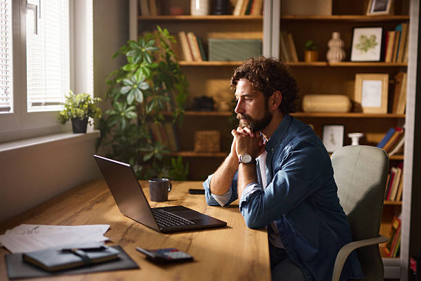 istock Focused freelancer working from home office on laptop 2225013576