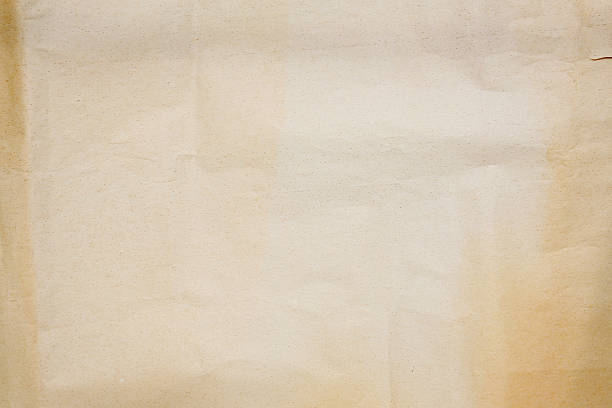 istock aged crumbled paper with lights and shadows, texture background 2225013819