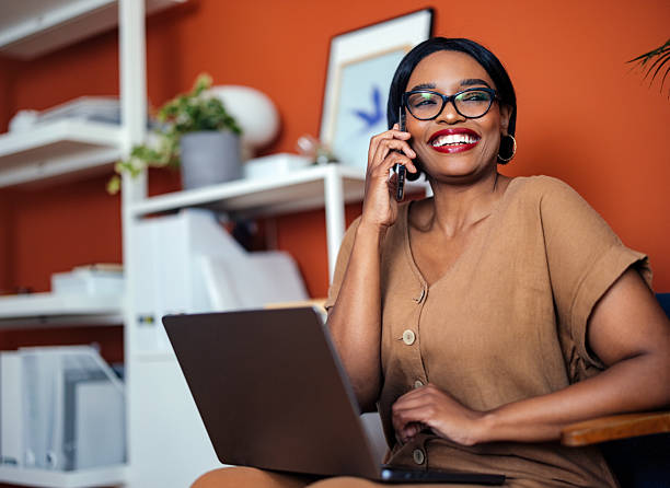 istock Professional Woman Smiling While Working in a Modern Home Office 2225013884
