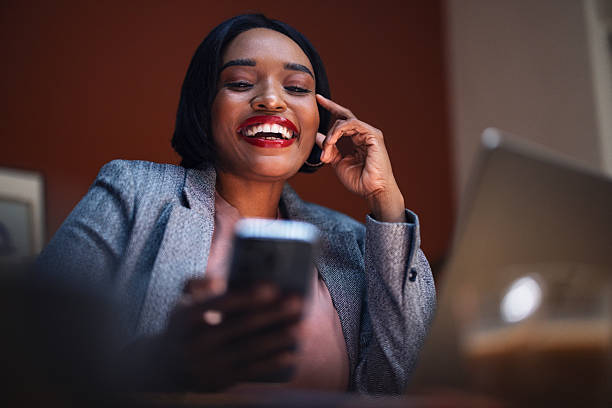 istock Smiling Professional Woman Enjoying Phone Call in Modern Office Workspace 2225013931