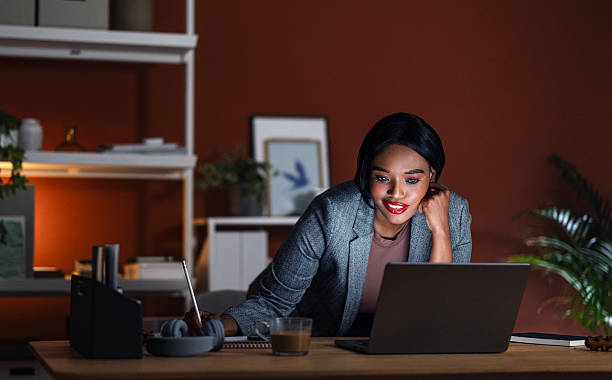 istock Young Professional Woman Working in a Modern Co-Working Space at Night 2225013950