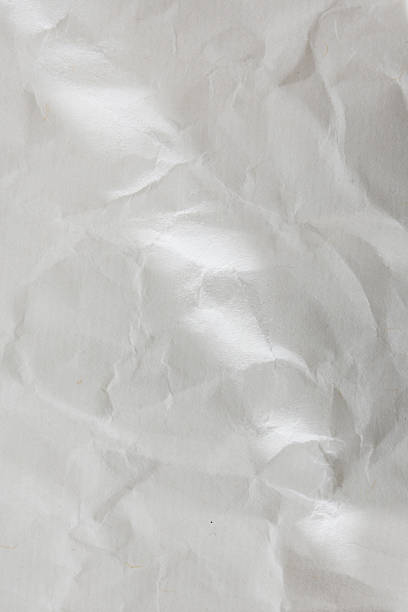 istock crumbled paper with lights and shadows, texture background 2225014195