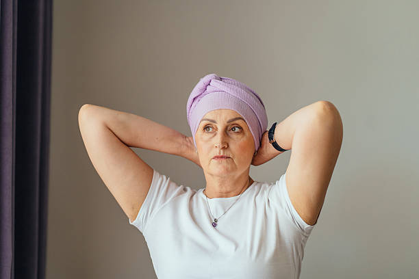 istock Strong woman finalizing turban with determined look 2225015665