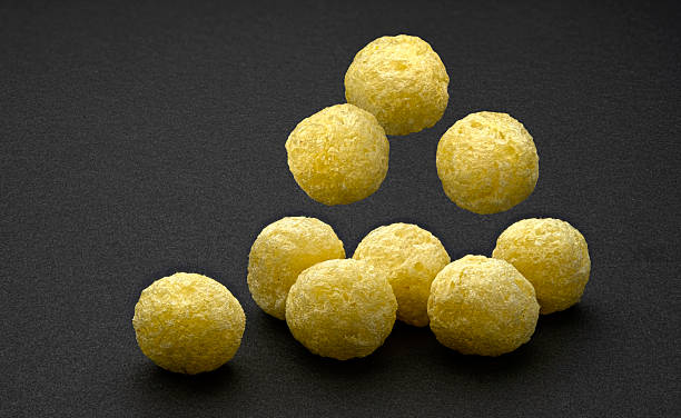 istock Falling corn balls isolated on black background, full depth of field 2225018355