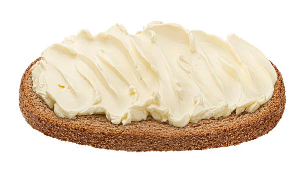 istock Rye bread slice with butter spread isolated on white background 2225018387