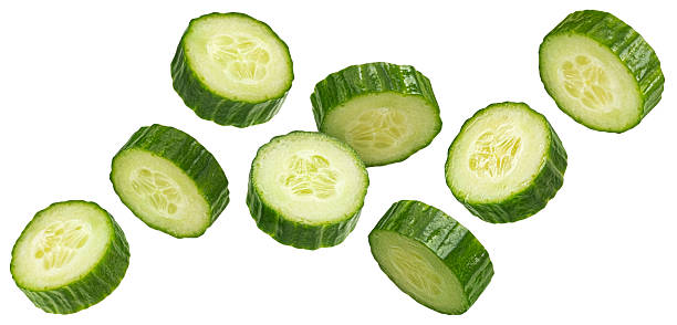 istock Falling cucumber slices isolated on white background with clipping path 2225018398