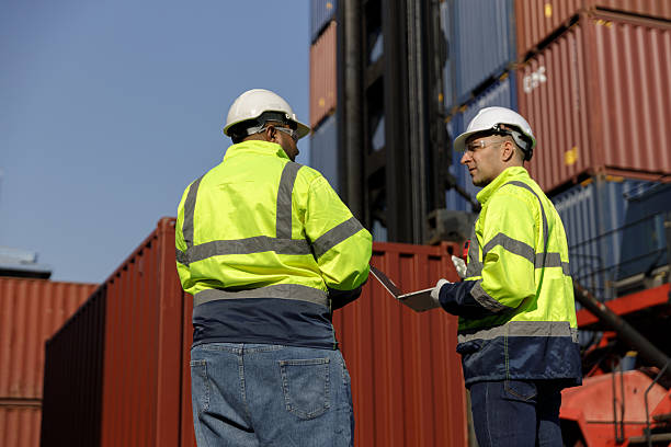 istock Engineers inspect goods and containers for export by global businesses. 2225020917