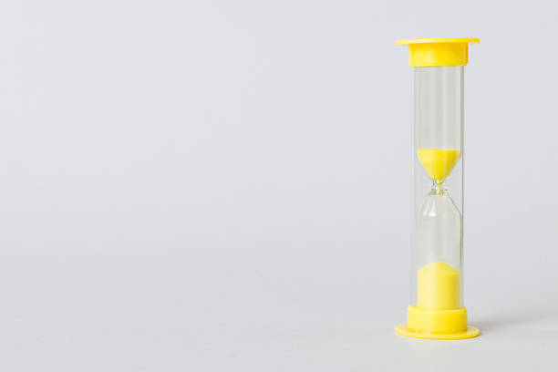 hourglass on the table, sand clock as time passing concept for business deadline, copy space.