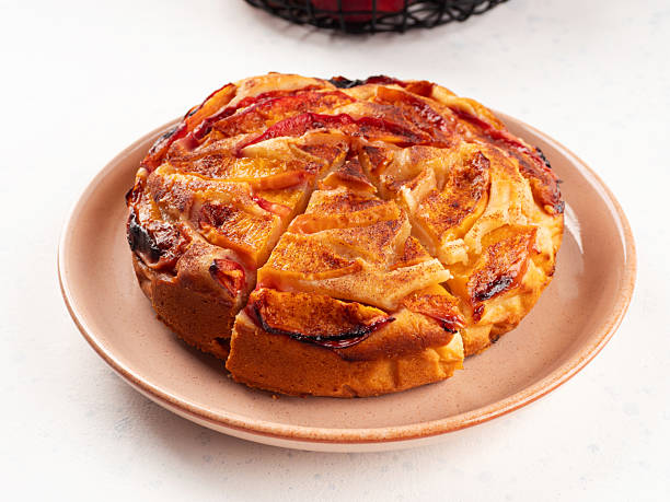istock Vegan nectarine peach cake on white table, summer fruit pie 2225028388