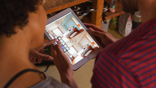 istock Couple Using Digital Tablet Researching Colour Schemes On Interior Decorating Website 2225029590
