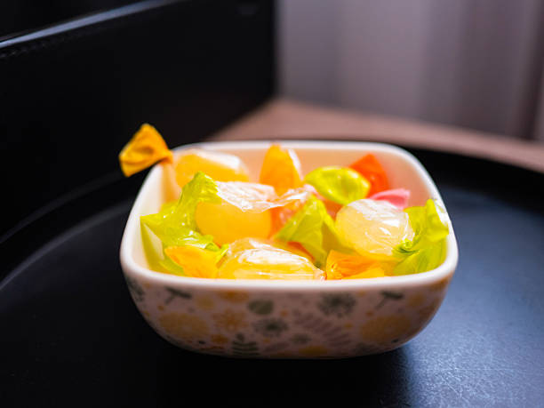 Colorful wrapped candies in a decorative bowl