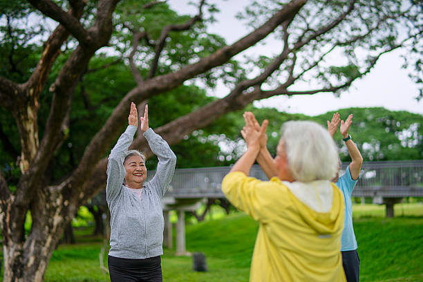 istock Group of seniors are exercising in public park. 2225030007