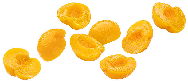 istock Canned peach or apricot fruit halves isolated on white background with clipping path 2225033472