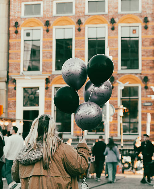 Low Angle View Of Colorful Balloons Flying Against Sky