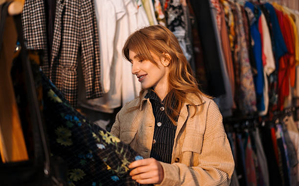 istock A Young Shopper Enthusiastically Exploring Vintage Fashion While at a Thrift Store 2225034937