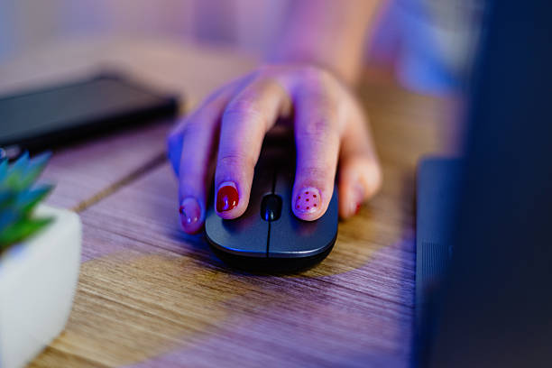 closeup view on asian young male gamer hand play online internet cyber sport